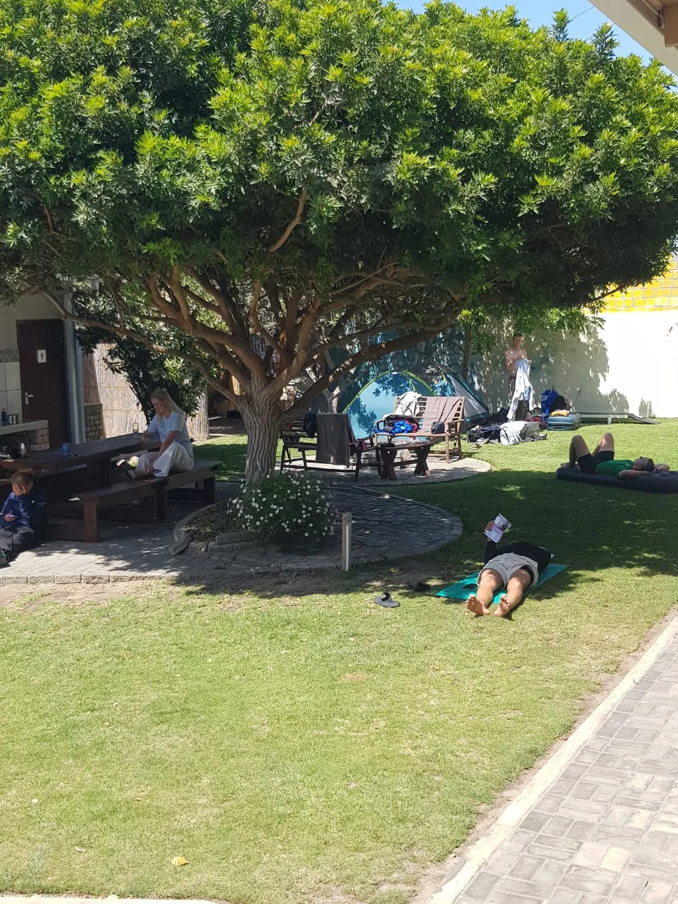 Guests relaxing in the camping garden