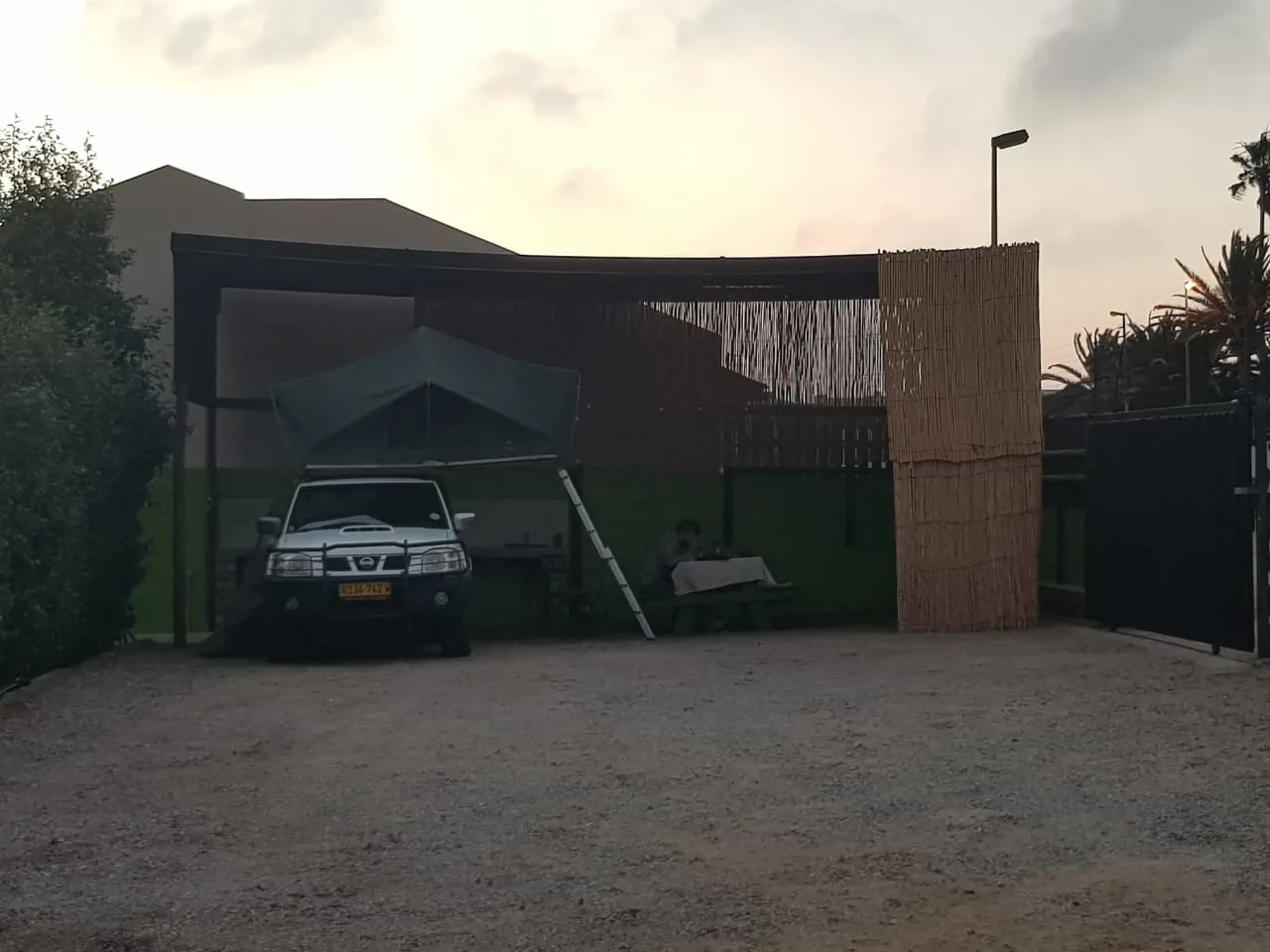 Sheltered camping pitch entrance