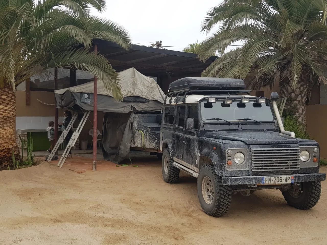 Overland vehicle with a rooftop tent