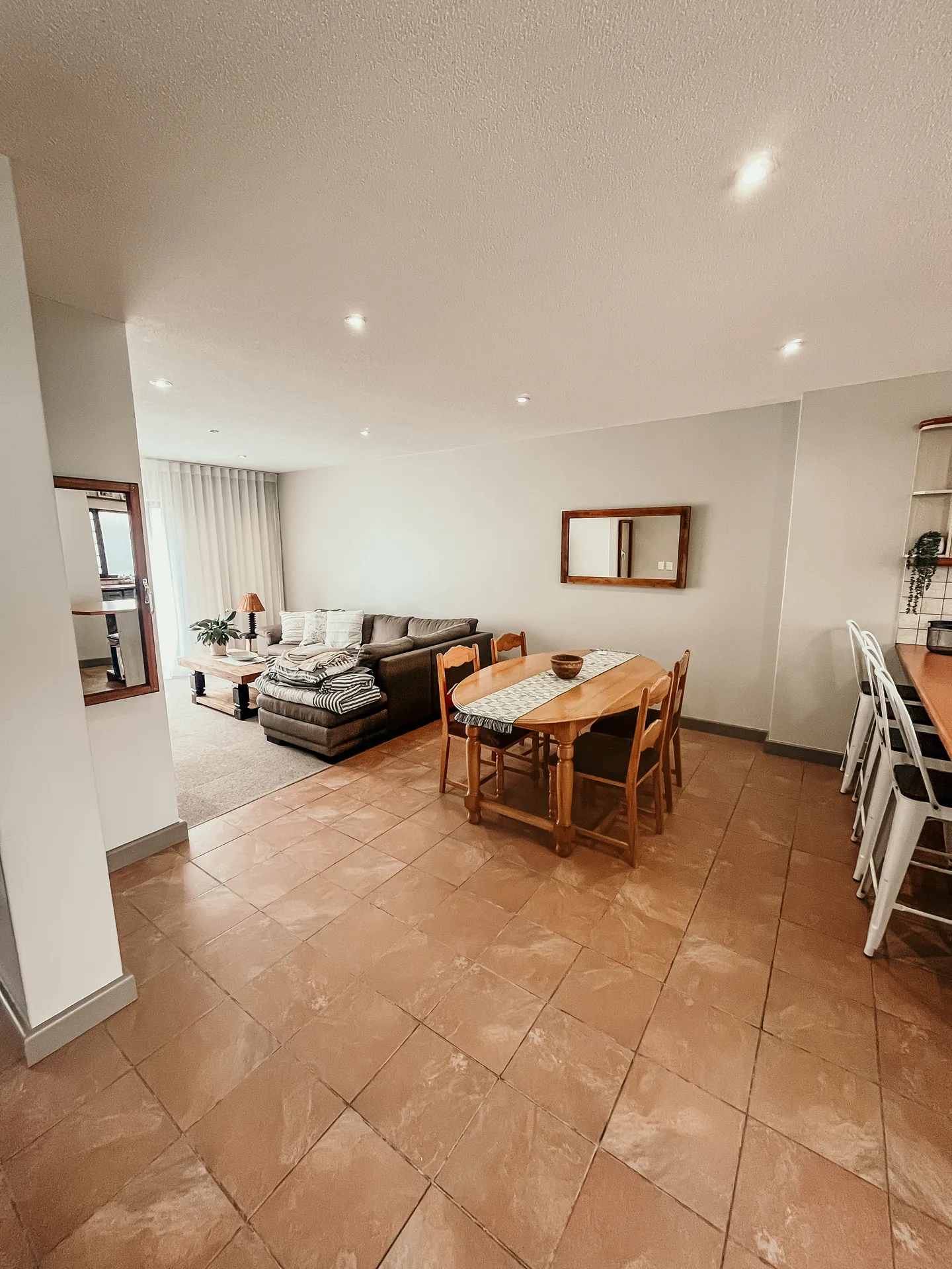 Moringa open-plan living and dining area beside the kitchen