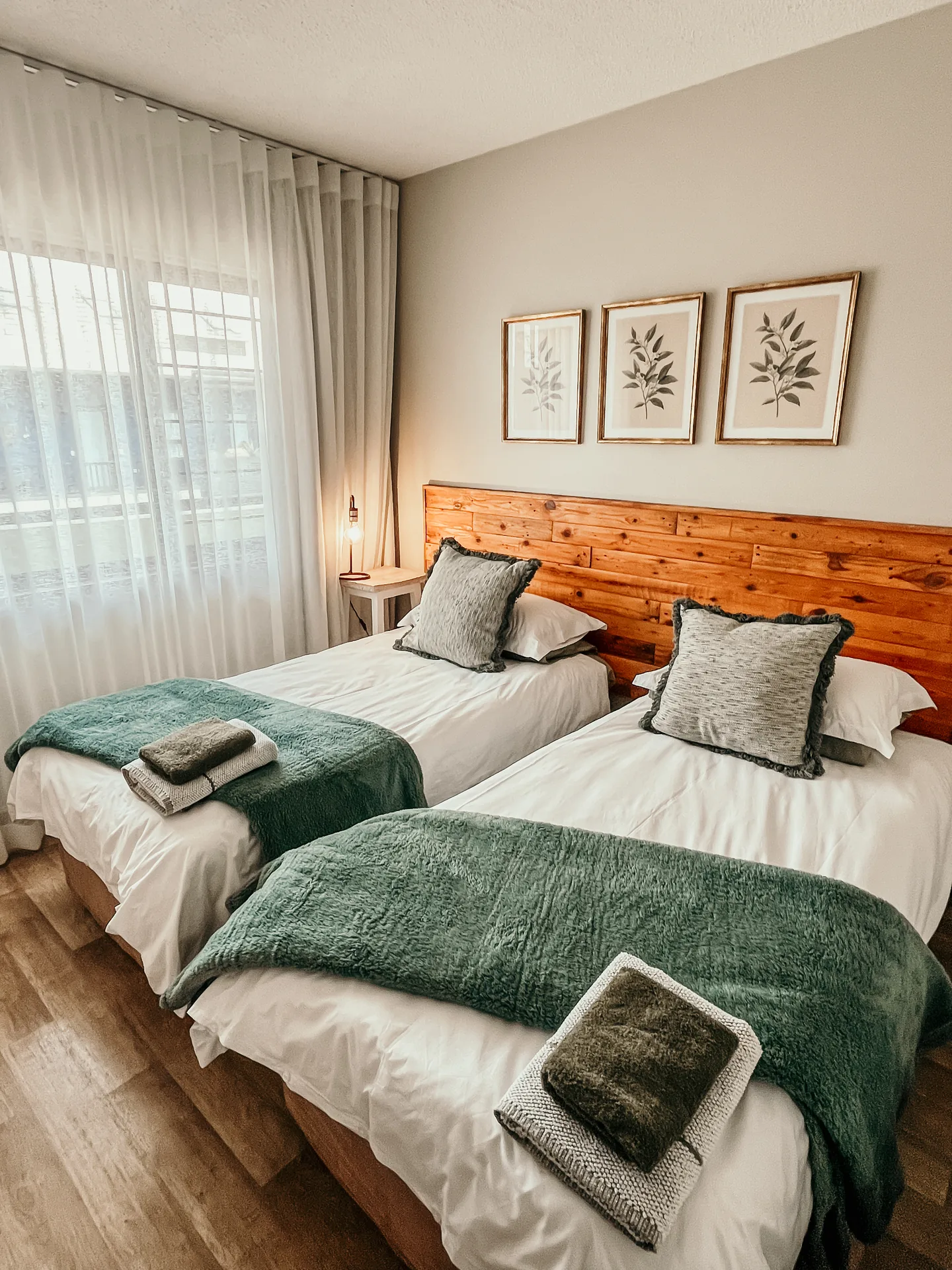 Moringa twin bedroom with two made-up single beds